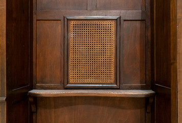 Wooden confessional from parishioner point of view - obrazy, fototapety, plakaty
