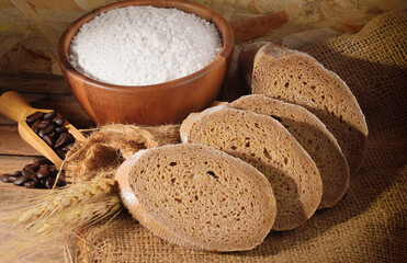 Whole wheat bread on wooden background