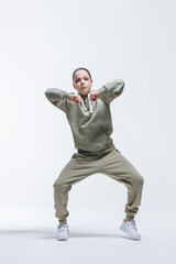 Young beautiful cool looking girl posing in studio