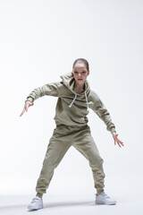 Young beautiful cool looking girl posing in studio