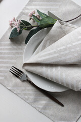 table setting. napkins and cutlery. natural fabrics.