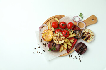 Concept of tasty eating with grilled vegetables on white background