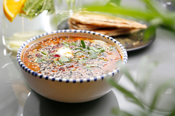 Lentil soup with tomatoes, sour cream and herbs.
Vegetarian food, colorful and appetizing dishes.