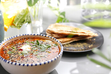 Lentil soup with tomatoes, sour cream and herbs.
Vegetarian food, colorful and appetizing dishes.