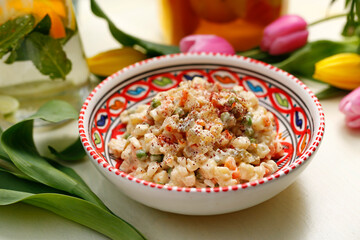 Vegetable salad with mayonnaise.
A colorful appetizing dish. Culinary photography, food styling.