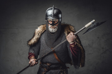 Studio shot of antique old age viking with axe