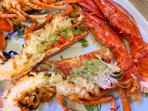 Grilled whole lobster with garlic and butter -  close up