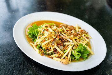 Thai spicy three eggs salad, popular thai seafood dish