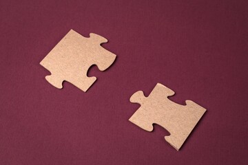 Close-up of puzzle elements on a purple background. Business solutions, success and strategy concept