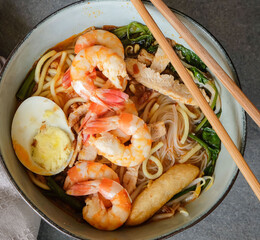 Popular and famous street food of Penang / Spicy Hokkien Prawn Noodle Soup / Broth made from fried prawn shells, giving that unmistaken aromatic fragrance that make this meal a must try meal