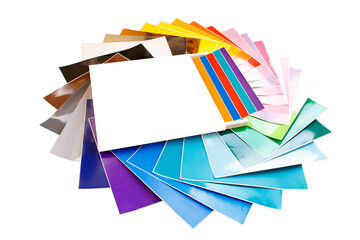 Twisted pile of colorful 12x12 sheets of adhesive paper with box isolated over the white background. Mockup.