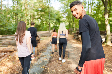 Obraz premium Friends in a Nordic Walking hiking group