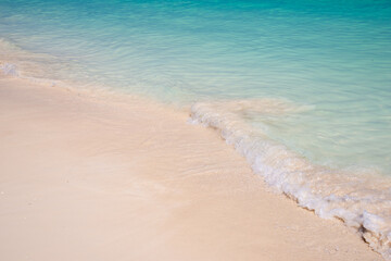 Fototapeta na wymiar Sand and caribbean tropical beach, summer background with copy space