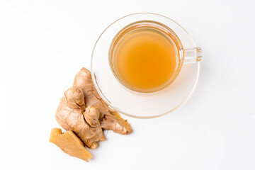 Top view of ginger water and fresh ginger isolated on a white background. Ginger is a useful herb and has medicinal properties.