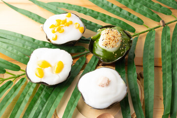 Top view of mix Thai Pudding with Coconut Cream, 4 topping is Corn Taro Ginkgo biloba seed and pandan, Traditional Thai dessert.