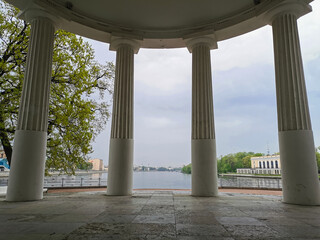 View from the pavilion "Under the flag" on the columns and the river in the park on the Elagin Island of St. Petersburg.