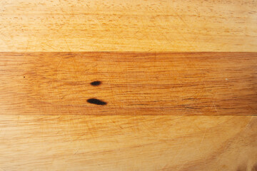 Top view of scratched wooden cutting board, old wooden cutting board, natural background.