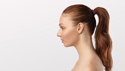 Profile Portrait Of Red-Haired Female Looking At Copyspace, White Background