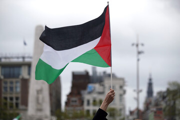Palestinian waving flags in Amsterdam
