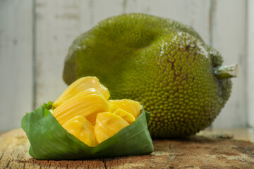 Jackfruit is delicious tropical fruits, Jackfruit is an exotic fruit grown in tropical regions of the world on wooden table with copy space. Also as know as jack tree.
