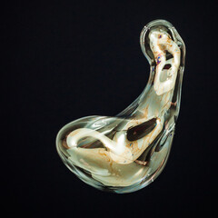 Amorphous and colorful isolated soap bubble with black background.