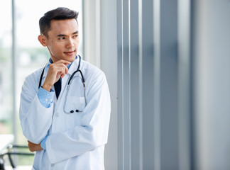 Content male medic looking at camera in hospital