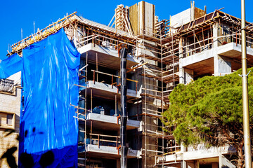 Construction of a building using monolithic frame construction technology on sunny day