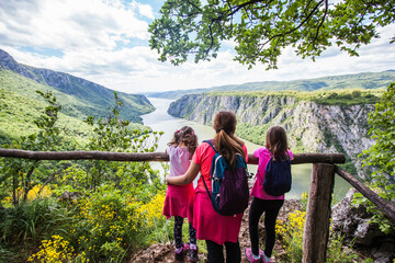 Family at viewpoint, beautiful nature landscape, amazing view on gorge Danube river