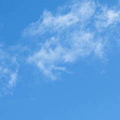 Background of blue sky with white clouds