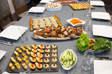 Catering. Table with various canapes, sandwiches and snacks.