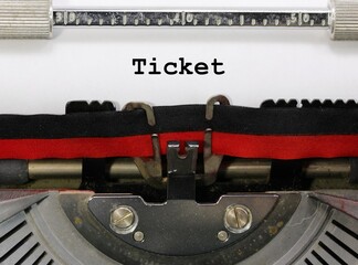 Word TICKET writen with an old typewriter on white paper