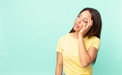 young hispanic woman feeling bored, frustrated and sleepy after a tiresome