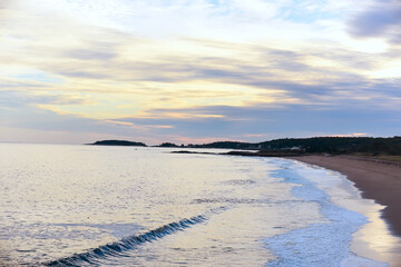 Atlantic coastline at sunset. Deserted rocky coast. USA. Maine.
