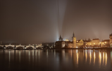 Night shot of Charles Bridge - Karluv most - over river Vltava in Prague; taken from Strelecky ostrov, long exposure