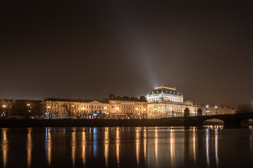 Fototapeta na wymiar The historic National Theatre in Prague (Národní divadlo) with the sorrounding buildings, shot at night from Strelecky ostrov - long exposure