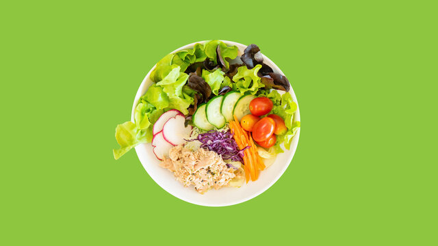 Tuna salad with green isolated background.
