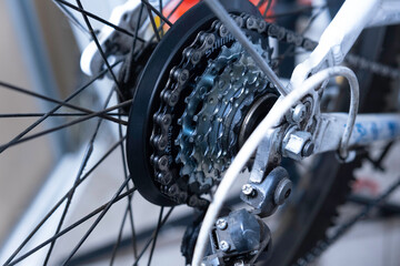 Closeup of a bicycle gears mechanism and chain on the rear wheel of mountain bike. 
