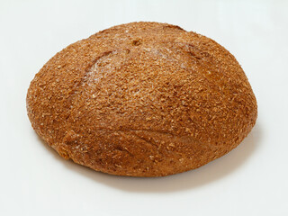 Loaf of rye bread on white background
