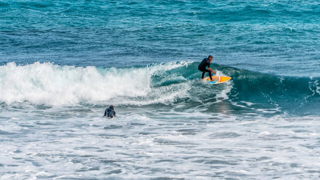 surfing on the beach of la cicer in Las Plamas de Gran Canaria