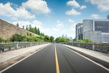 Asphalt road and modern city