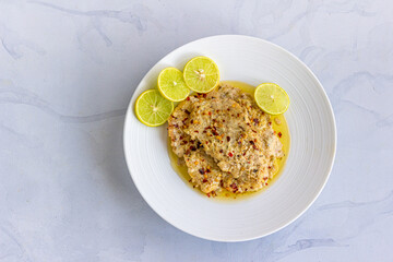 Baked Fish Fillet Directly Above Photo on White Background