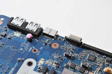 part of the motherboard with USB outputs for the laptop.blue color
