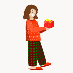 A girl in slippers and pajamas receives a gift.