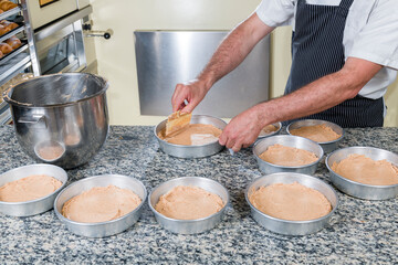 Pastry chef prepares hazelnut cake