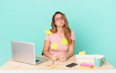 pretty woman feeling sad and whiney with an unhappy look and crying. telework concept