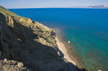 Traces of soil erosion and weathering on the mountain slope.