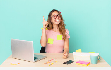 pretty woman feeling like a happy and excited genius after realizing an idea. telework concept