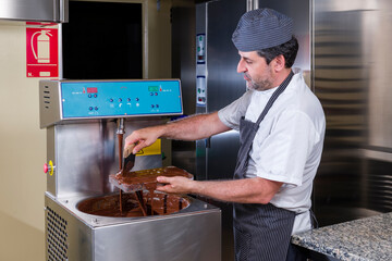 Pastry chef prepares dark chocolates