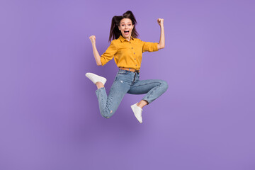 Full length body size photo jumping high girl smiling gesturing like winner isolated pastel purple color background