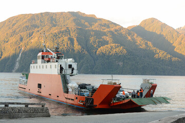 cargo ship arriving at port unloading its cargo. on the southern highway